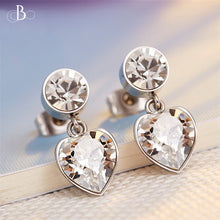 Cargar imagen en el visor de la galería, Aretes corazón y punto de luz con cristales Swarovski