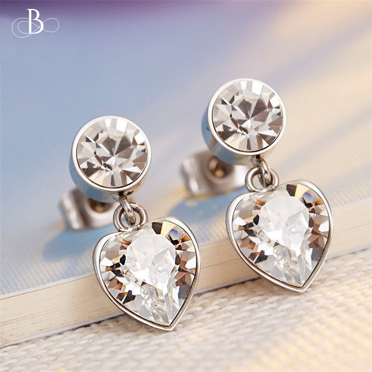 Aretes corazón y punto de luz con cristales Swarovski