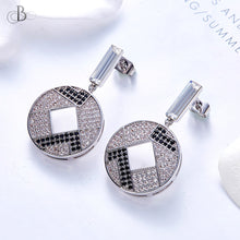 Cargar imagen en el visor de la galería, Aretes disco con cristales Swarovski