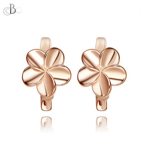 Aretes de plata flores doradas