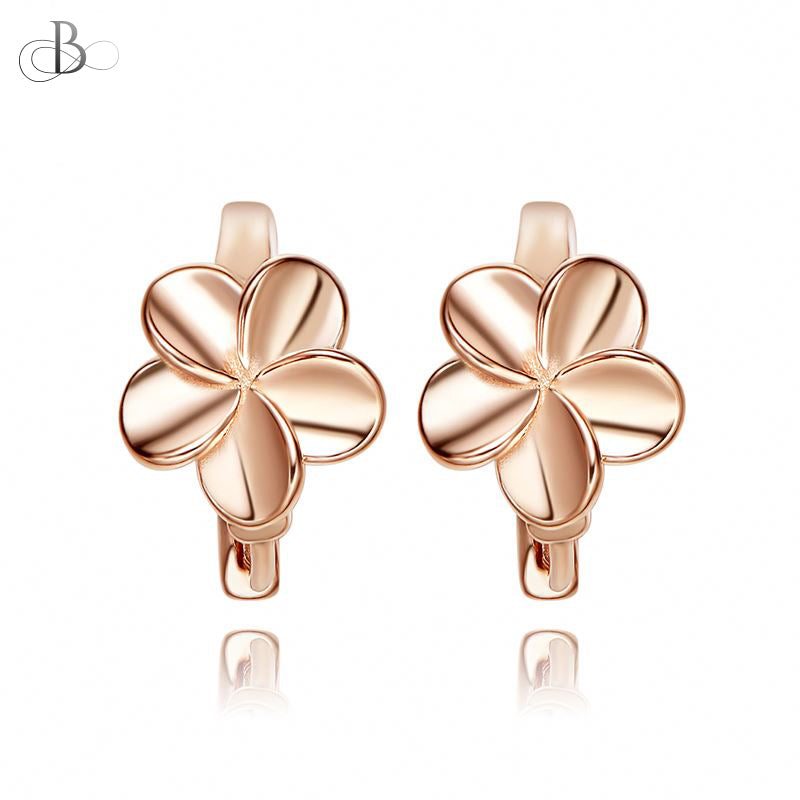 Aretes de plata flores doradas