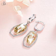 Cargar imagen en el visor de la galería, Aretes cristal colgante color topacio con cristales Swarovski