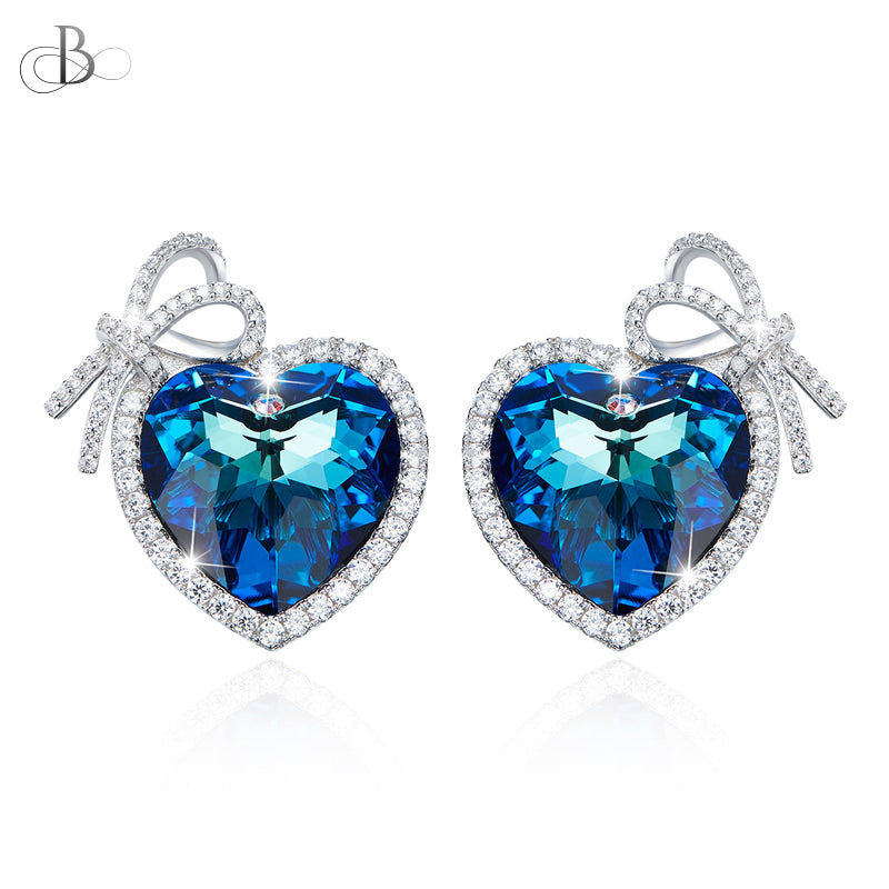 Aretes de plata corazón con cristal Swarovski envueltos en cinta de plata