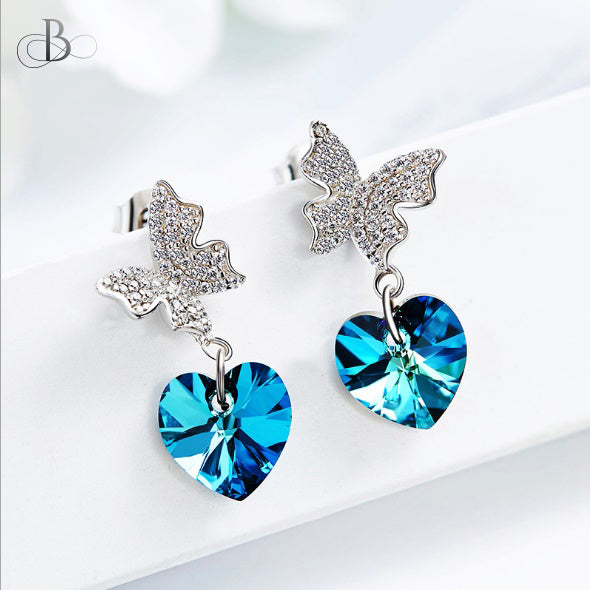 Aretes mariposa brillante y corazón de plata color zafiro con cristales Swarovski