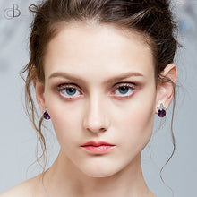 Cargar imagen en el visor de la galería, Aretes mariposa y punto de luz de plata color amatista con cristales Swarovski