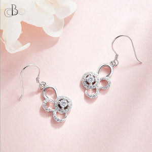 Aretes de plata punto de luz y pétalos con zirconia y cristales Swarovski