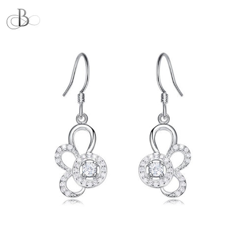 Aretes de plata punto de luz y pétalos con zirconia y cristales Swarovski