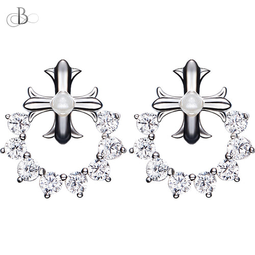 Aretes pequeña cruz de plata rodeada con cristales Swarovski