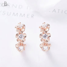 Cargar imagen en el visor de la galería, Aretes de plata flores doradas embellecidas con cristales Swarovski
