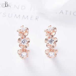 Aretes de plata flores doradas embellecidas con cristales Swarovski