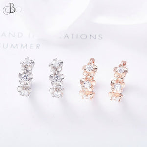 Aretes de plata flores doradas embellecidas con cristales Swarovski